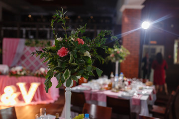 Festive table decoration in Lilac colours. Wedding decorations. A very nicely decorated wedding table with plates and serviettes.