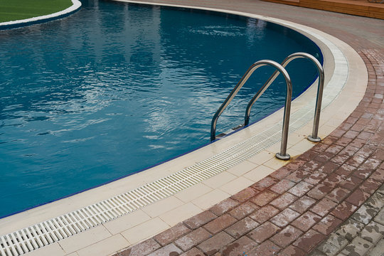 stainless steel ladder and swimming pool
