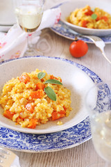 Pumpkin risotto and glass of wine white