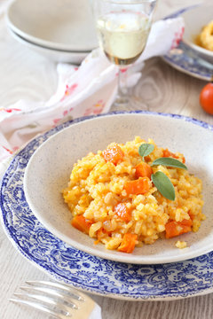 Pumpkin risotto and glass of wine white