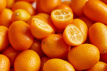 Bunch of fresh kumquats in the organic food market