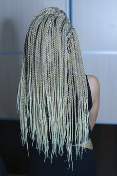 Senegalese twisted pigtails, weave through the braid, many African braids, hair is removed into the hair, the texture of the braids