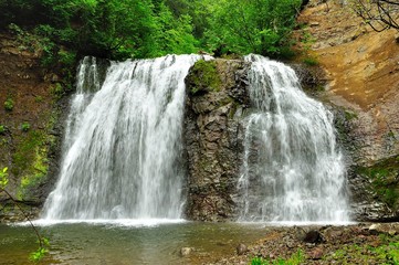 Fototapeta na wymiar twin waterfall of mountain river
