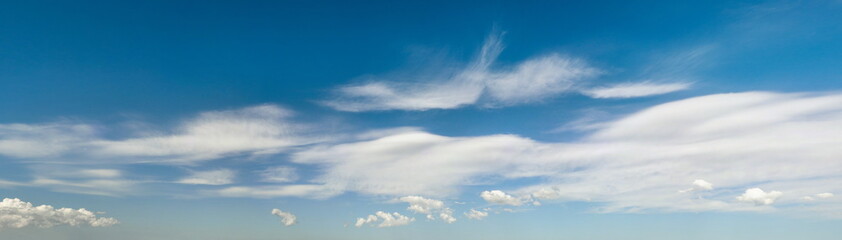 Obraz premium Panoramic picture of beautiful white clouds in the blue sky as texture. Creative concept idea background.