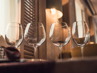 Empty glasses in restaurant or cafe, tableware, vintage toned