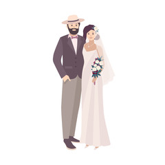 Elegant bride dressed in fancy vintage gown and groom wearing stylish suit and hat