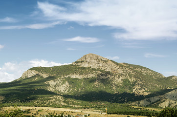 Obraz premium Beautiful sky above mountain landscape of crimea valley. St George mountain top