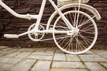 Urban bicycle with a fixed mechanism on the wall background, an old bicycle. Retro-stylish cycling in the city