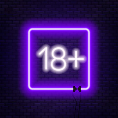 Eighteen plus neon sign on brick wall background.