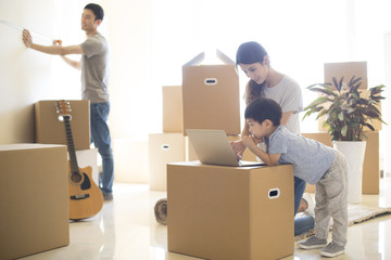 Happy young family moving to a new house