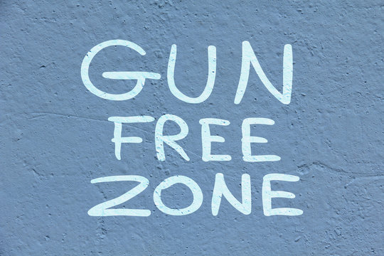 Words free from weapons zone on the old blue wall