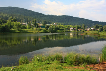 Village on the bank of a pond