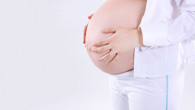 closeup.view of a pregnant woman with back pain