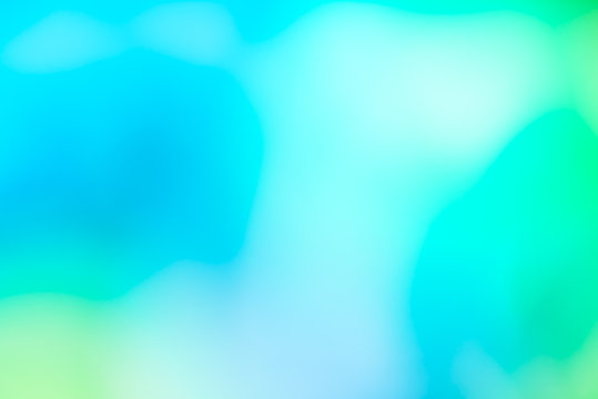 Abstract pale watercolour turquoise bluish yellow green background. Looking upwards to the skies. Happy summer feeling muted pastel wallpaper.