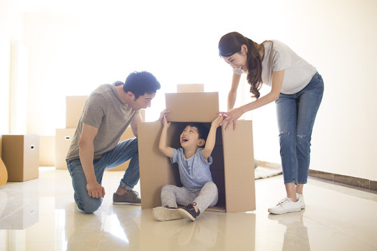 Happy young family moving to a new house