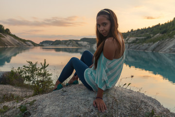 Girl on the lake at sunset