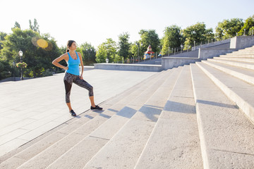 Sports woman preparing for a challenge. Motivated female athlete training hard.