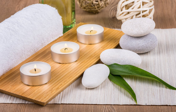 Spa concept / Spa decoration with candles, towels and stones