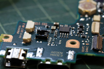 Electronics background technology close up of the green kit circuit board. Application Specific Integrated Circuit..