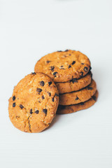 Chocolate cookies stacked on a white background