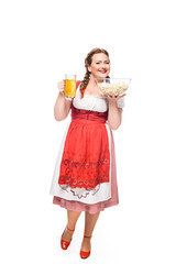 oktoberfest waitress in traditional bavarian dress holding mug of light beer and popcorn isolated on white background