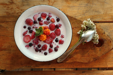 breakfast in the village berries with milk and mint