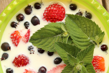 breakfast in the village berries with milk and mint