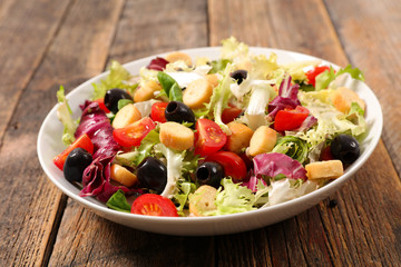 vegetable salad on wood background