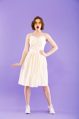 Full length portrait of a shocked young woman