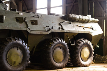 Army equipment. An armored personnel carrier in a military garage.