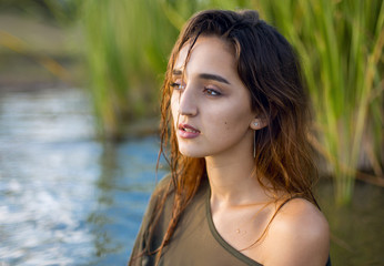 summer portrait of a swimming girl, emotional portrait of a girl in the water