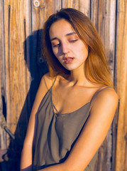Fototapeta premium Girl in a light dress on the straps, sexy grunge girl sensually