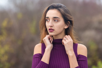 Girl in lilac dress on nature in autumn, Portrait of a beautiful girl in the autumn in the forest	