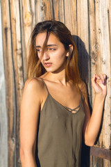 Fototapeta premium Girl in a light dress on the straps, sexy grunge girl sensually 