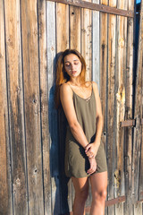 Fototapeta premium Girl in a light dress on the straps, sexy grunge girl sensually 