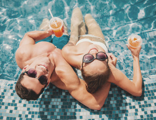 Top view. Smiling Couple in Swimming Pool in Summer.