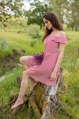 Portrait of a beautiful girl in the summer in the forest	