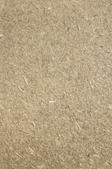 Construction material made with dry straw and clay.