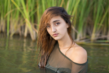 summer portrait of a swimming girl, emotional portrait of a girl in the water