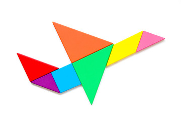 Fototapeta na wymiar Color wood tangram puzzle in airplane shape on white background