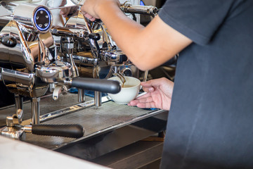 barista making coffee