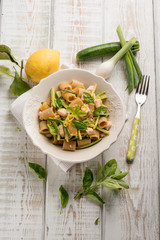 fresh salmon pasta with zucchinis leek and grated lemon peel