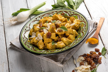 oriental meat stew with almond tumeric and dried grape