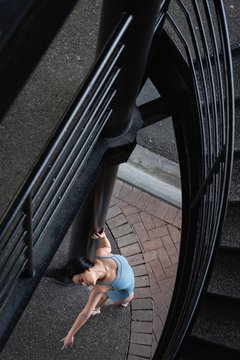 Female ballet dancer dancing on the street