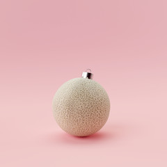 Melon ball christmas on pastel pink background. Creative idea minimal concept.