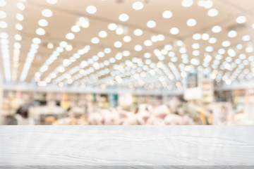 White marble table top on blur coffee shop window