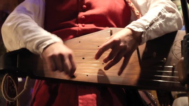 the man plays the cymbals