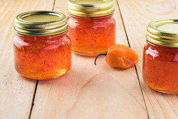 Glass jars with habanero jelly.