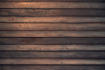 Obraz premium dark brown wood plank of old tradition house for wood texture background