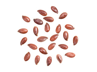 Some linseeds or flax seed spread out isolated on white background
